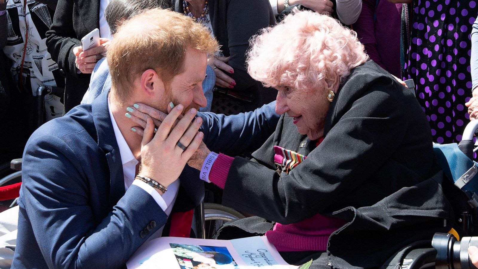 PHOTO: Prince Harry is embraced by 98-year-old Daphne Dunne outside of the Opera House in Sydney, Australia, Oct. 16, 2018.