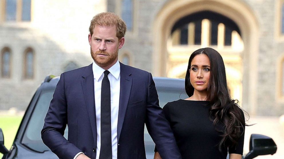 PHOTO: Prince Harry, Duke of Sussex, and Meghan, Duchess of Sussex on the long Walk at Windsor Castle arrive to view flowers and tributes to HM Queen Elizabeth, Sept. 10, 2022 in Windsor, England.