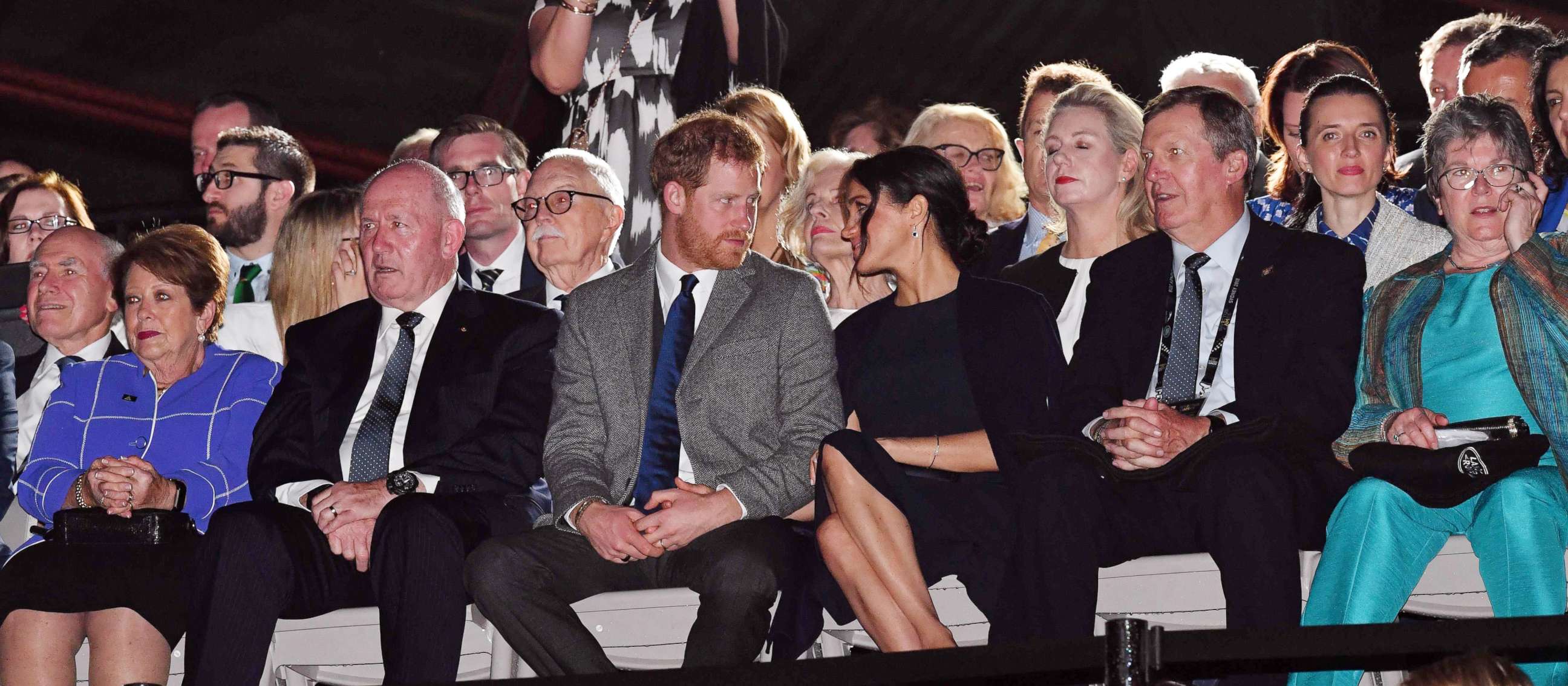 PHOTO: Prince Harry, The Duke of Sussex and Meghan Markle, The Duchess of Sussex talk during the opening ceremony of the Invictus Games in Sydney, Oct. 20, 2018.