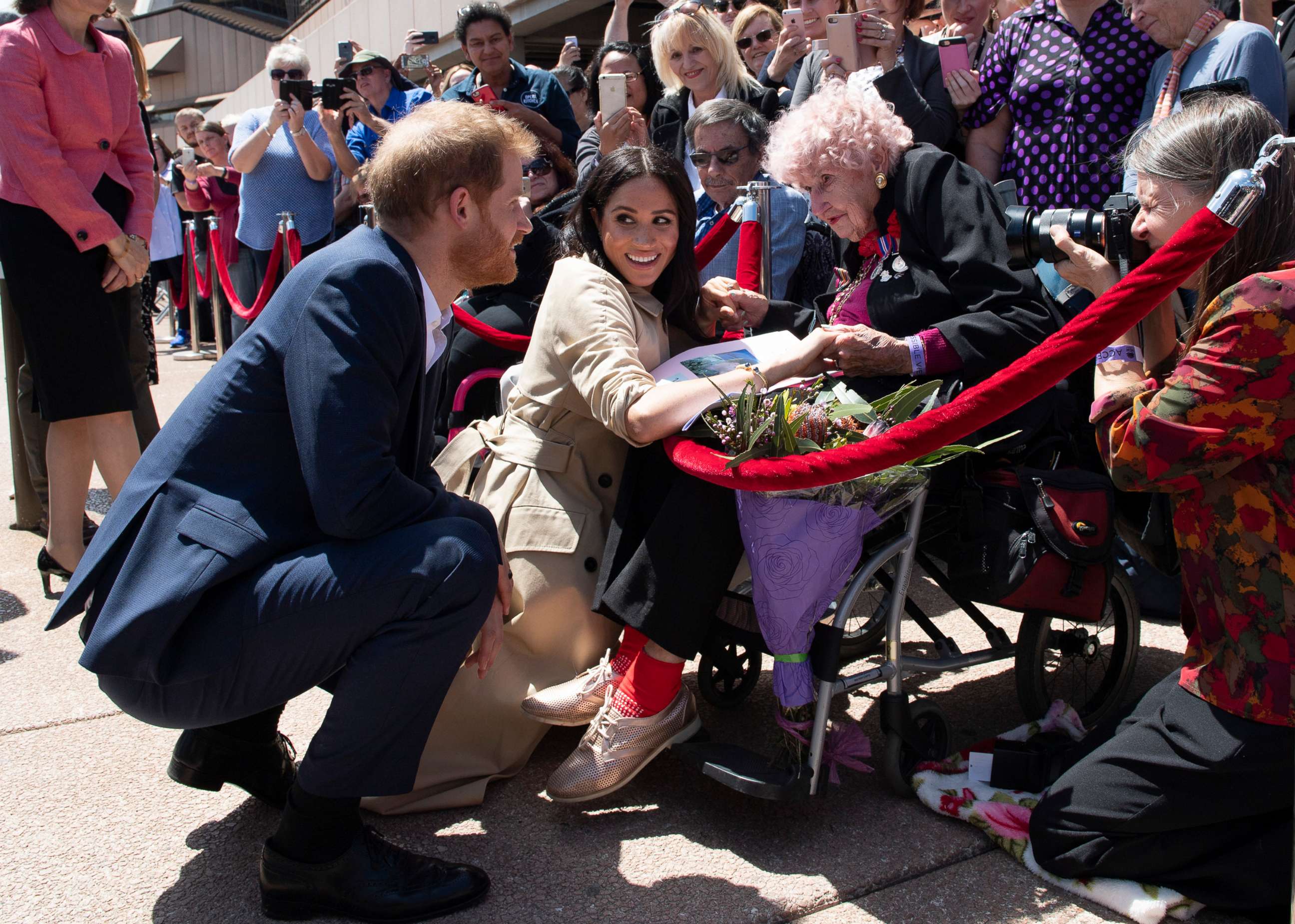 PHOTO: Prince Harry, Duke of Sussex and Meghan, Duchess of Sussex meet 98 year old Daphne Dunne during a meet and greet at the Sydney Opera House, Oct. 16, 2018, in Sydney.