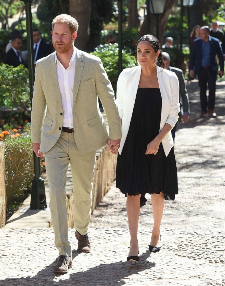 Prince Harry, Duke of Sussex and Meghan, Duchess of Sussex walk through the walled public Andalusian Gardens which has exotic plants, flowers and fruit trees during a visit, Feb. 25, 2019, in Rabat, Morocco.