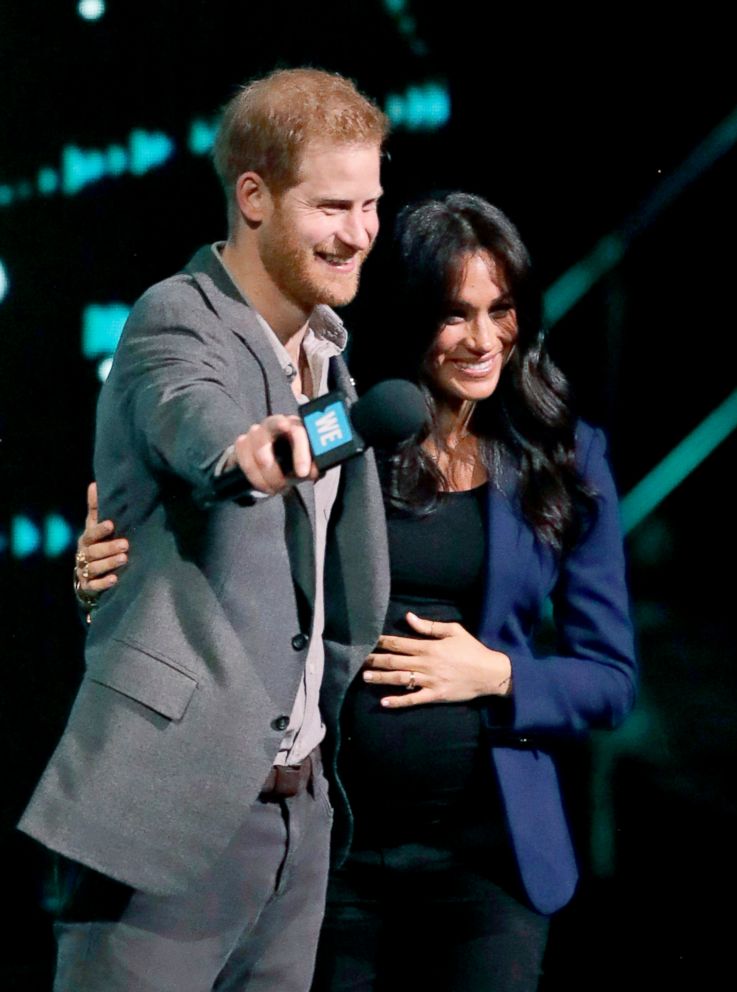 PHOTO: Meghan the Duchess of Sussex, is brought on stage by Britain's Prince Harry during his speech at WE Day UK, a global initiative to encourage young people to take part in positive social change at the SSE Arena in Wembley, London,  March 6, 2019.