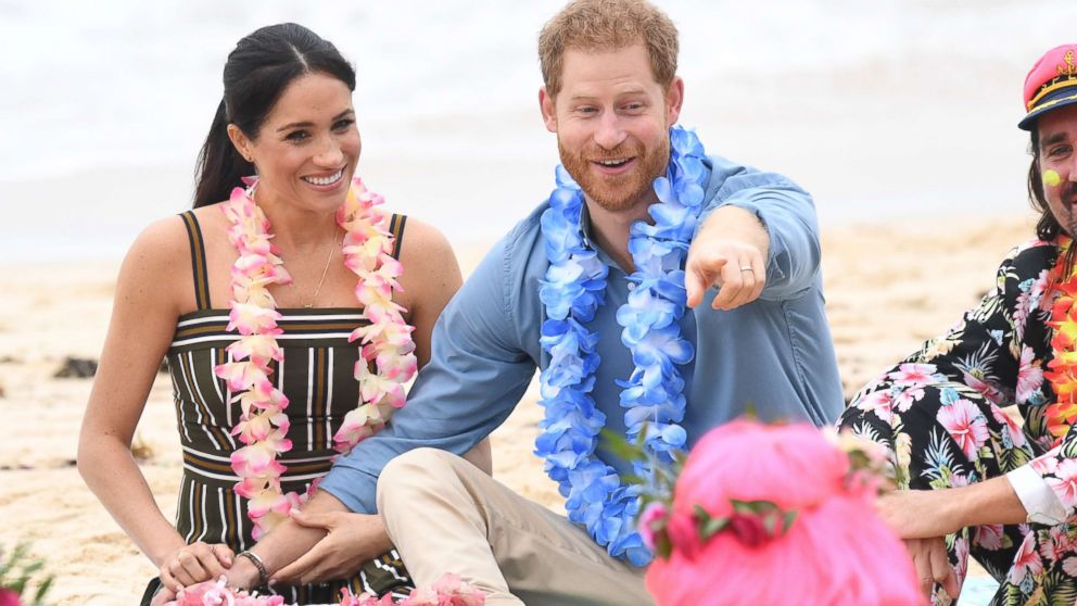 PHOTO: Meghan and Prince Harry talk to members of OneWave, an awareness group for mental health and well-being at South Bondi Beach, Oct. 19, 2018, in Sydney, Australia. 