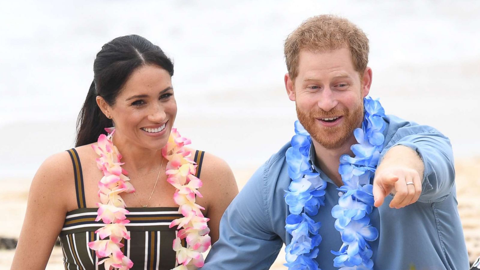 PHOTO: Meghan and Prince Harry talk to members of OneWave, an awareness group for mental health and well-being at South Bondi Beach, Oct. 19, 2018, in Sydney, Australia.