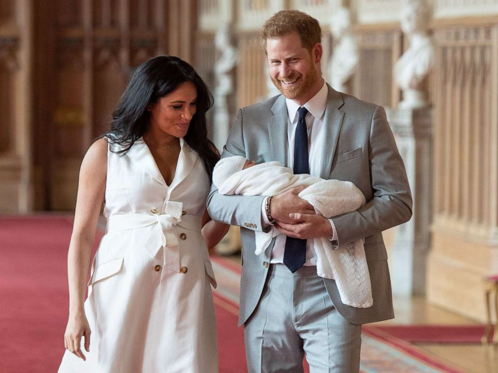PHOTO: Britains Prince Harry, Duke of Sussex and his wife Meghan, Duchess of Sussex, carry their newborn baby son in St Georges Hall at Windsor Castle in Windsor, England, May 8, 2019.