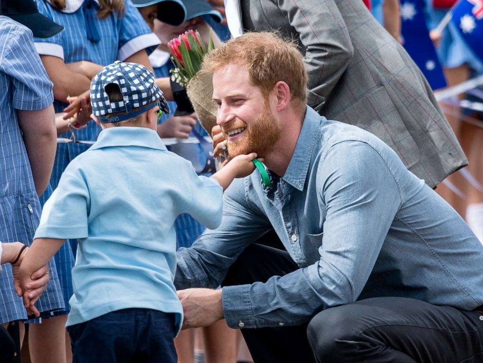 PHOTO: Prince Harry, Duke of Sussex is greeted by five-year-old Luke Vincent as they arrive at Dubbo Airport, Oct. 17, 2018, in Dubbo, Australia.