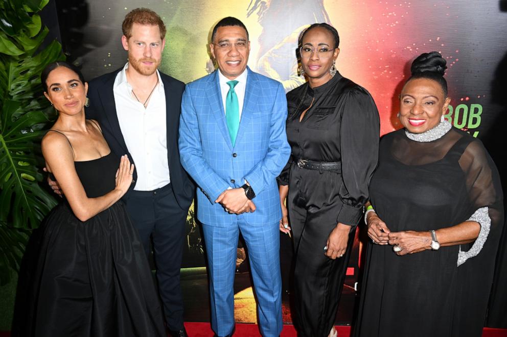 PHOTO: Meghan, Duchess of Sussex, Prince Harry, Duke of Sussex, Andrew Holness, Juliet Holness and Olivia Grange attend the Premiere of "Bob Marley: One Love" at the Carib 5 Theatre on January 23, 2024 in Kingston, Jamaica.