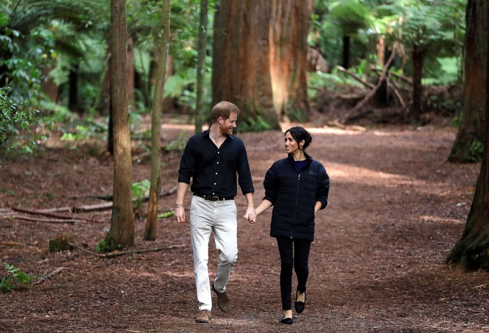 PHOTO: Britain's Prince Harry and Meghan, Duchess of Sussex walk through a Redwoods forest in Rotorua, New Zealand, Oct. 31, 2018.