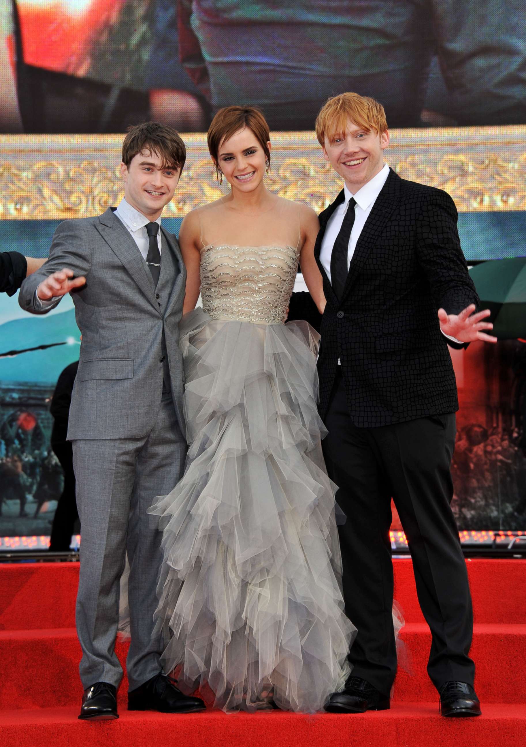 PHOTO: Actor Daniel Radcliffe, actress Emma Watson and actor  Rupert Grint attend the "Harry Potter And The Deathly Hallows Part 2" world premiere at Trafalgar Square, July 7, 2011, in London.