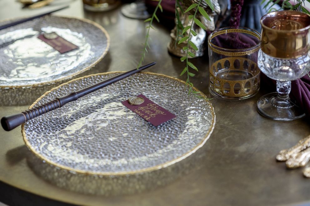 PHOTO: Hand carved wands from Fire Rising Wands were used as table settings.