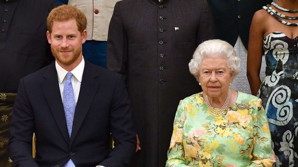 PHOTO: Prince Harry, Duke of Sussex and Queen Elizabeth II at the Queen's Young Leaders Awards Ceremony at Buckingham Palace on June 26, 2018 in London.