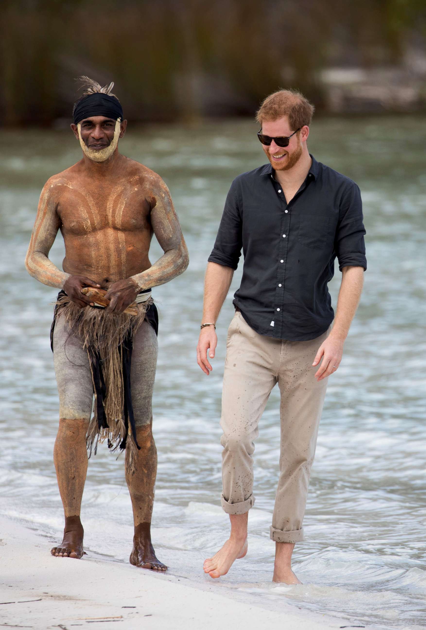 PHOTO: Prince Harry, The Duke of Sussex talks to aboriginal 'Song Man' Aaron Henderson on the shore of  Lake McKenzie on Fraser Island, Australia, Oct. 22, 2018.