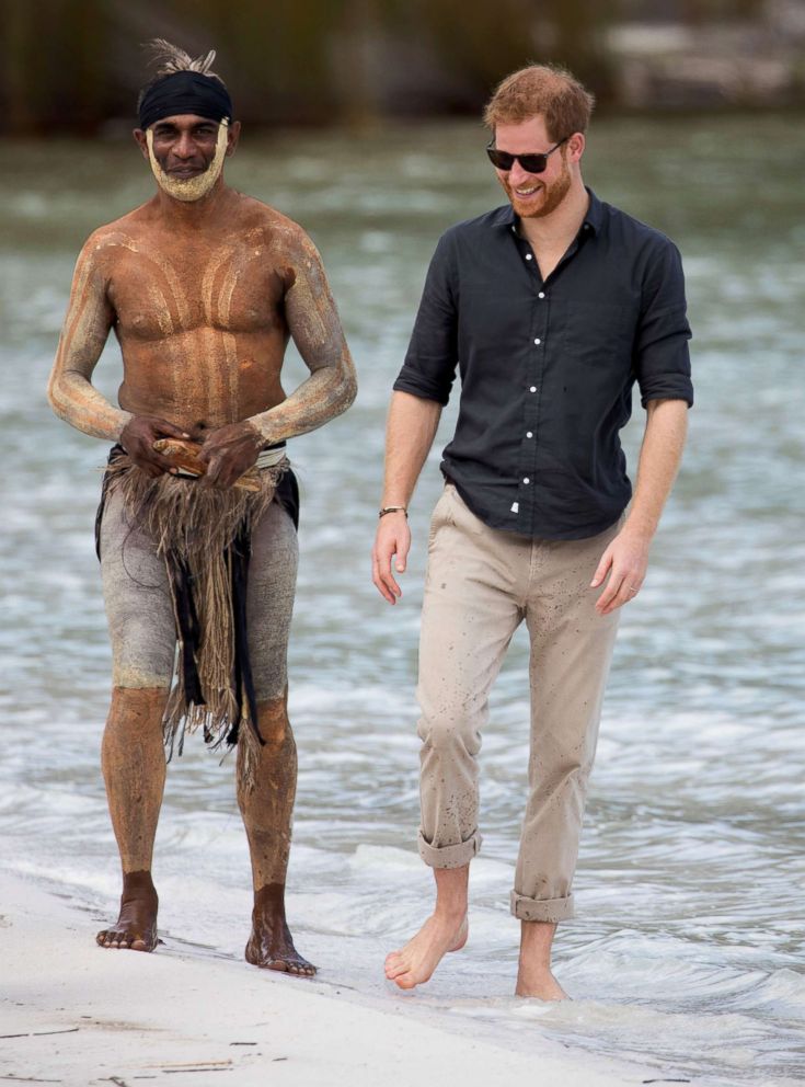 PHOTO: Prince Harry, The Duke of Sussex talks to aboriginal 'Song Man' Aaron Henderson on the shore of Lake McKenzie on Fraser Island, Australia, Oct. 22, 2018.