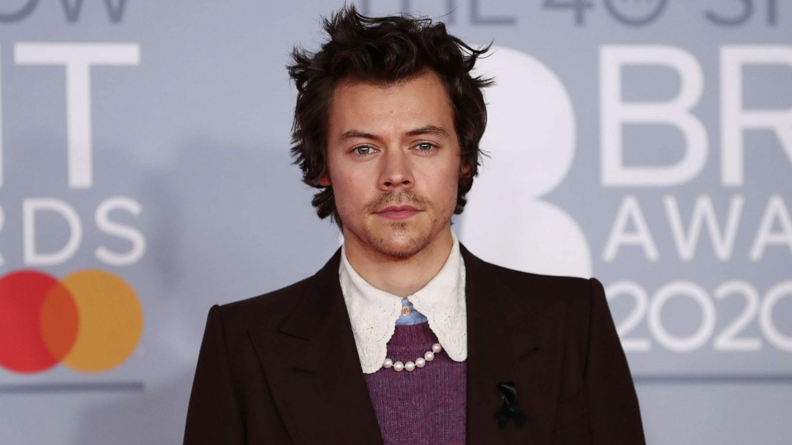 PHOTO: Harry Styles poses as he arrives for the Brit Awards at the O2 Arena in London, Feb. 18, 2020.