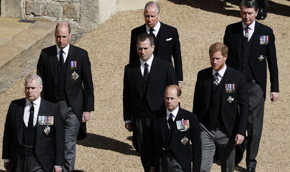 Prince William, Duke of Cambridge,center-left,Peter Phillips and Prince Harry, Duke of Sussex,march in the funeral procession of Prince Philip,Duke of Edinburgh to St George's Chapel in Windsor Castle in Windsor, England,April 17, 2021.