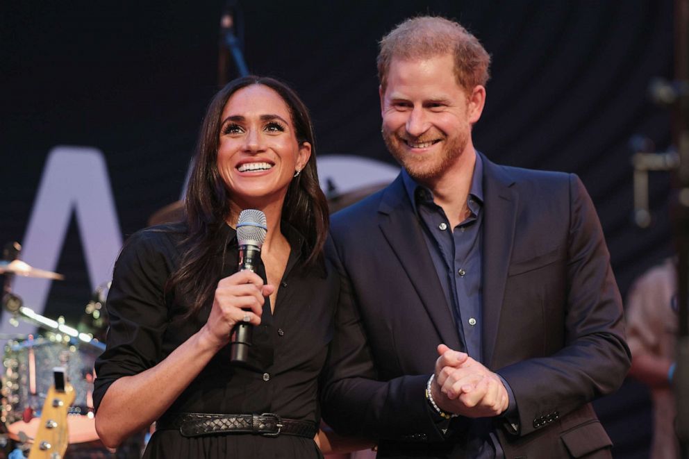 PHOTO: Prince Harry, Duke of Sussex and Meghan, Duchess of Sussex speak on stage at the "Friends @ Home Event" at the Station Airport during day three of the Invictus Games Düsseldorf 2023 on Sept. 12, 2023 in Duesseldorf, Germany.