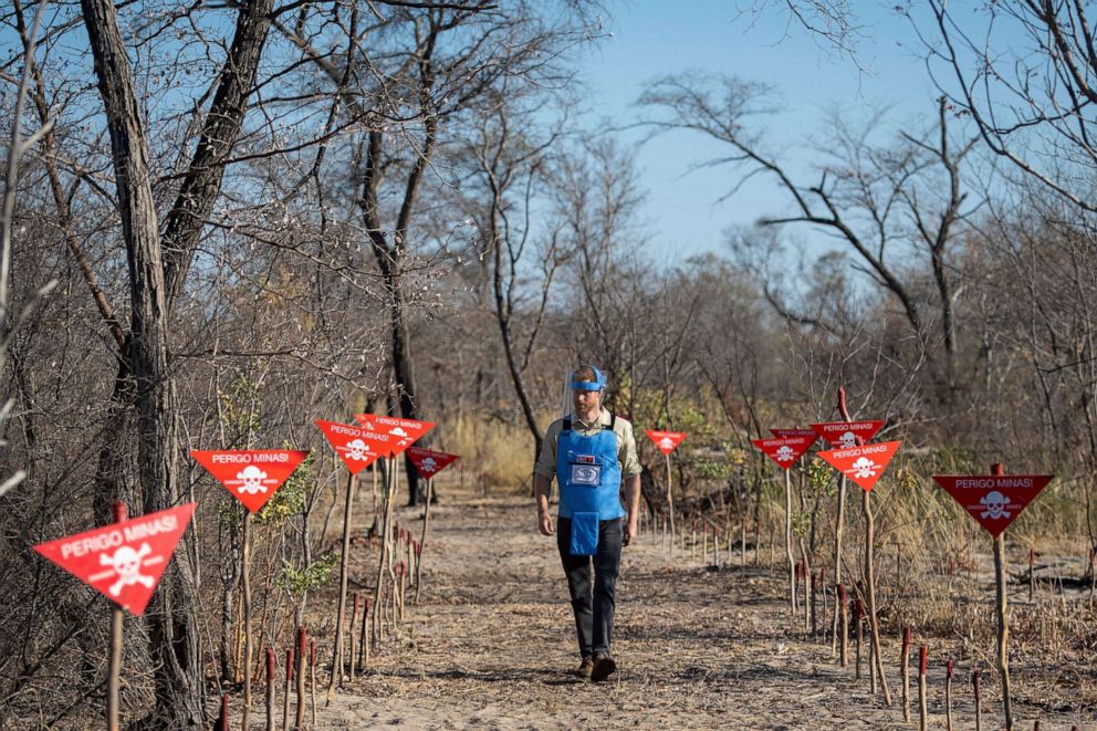 PHOTO: Britain's Prince Harry walks through a minefield in Dirico, Angola, Sept. 27, 2019