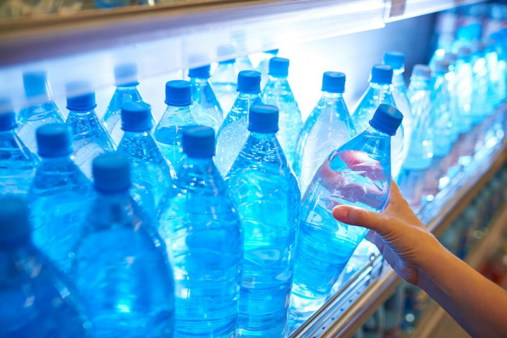 PHOTO: Bottles of water from a shelf.