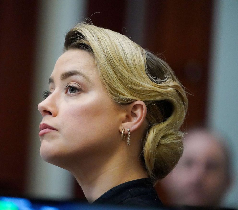 PHOTO: Actress Amber Heard listens in the courtroom at the Fairfax County Circuit Courthouse in Fairfax, Va., April 25, 2022. 