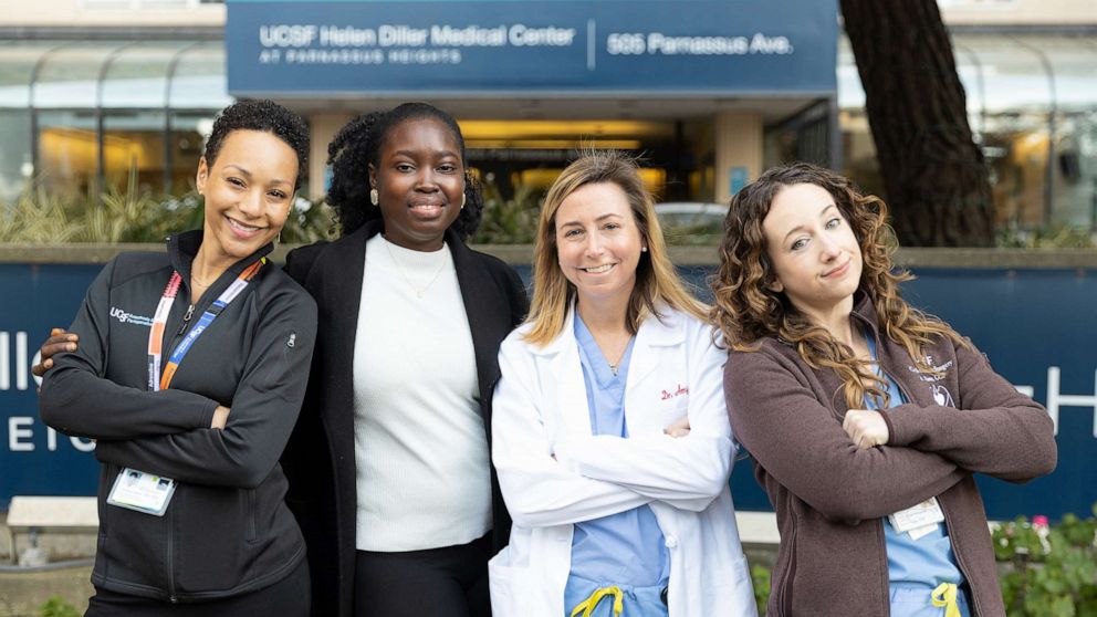 PHOTO: Dr. Charlene Blake (far left), Dr. Amy Fiedler (third from left), and perfusionist Ashley Risso (far right) were part of an all-women team that performed a heart transplant for patient Fatou Gaye (second from left).