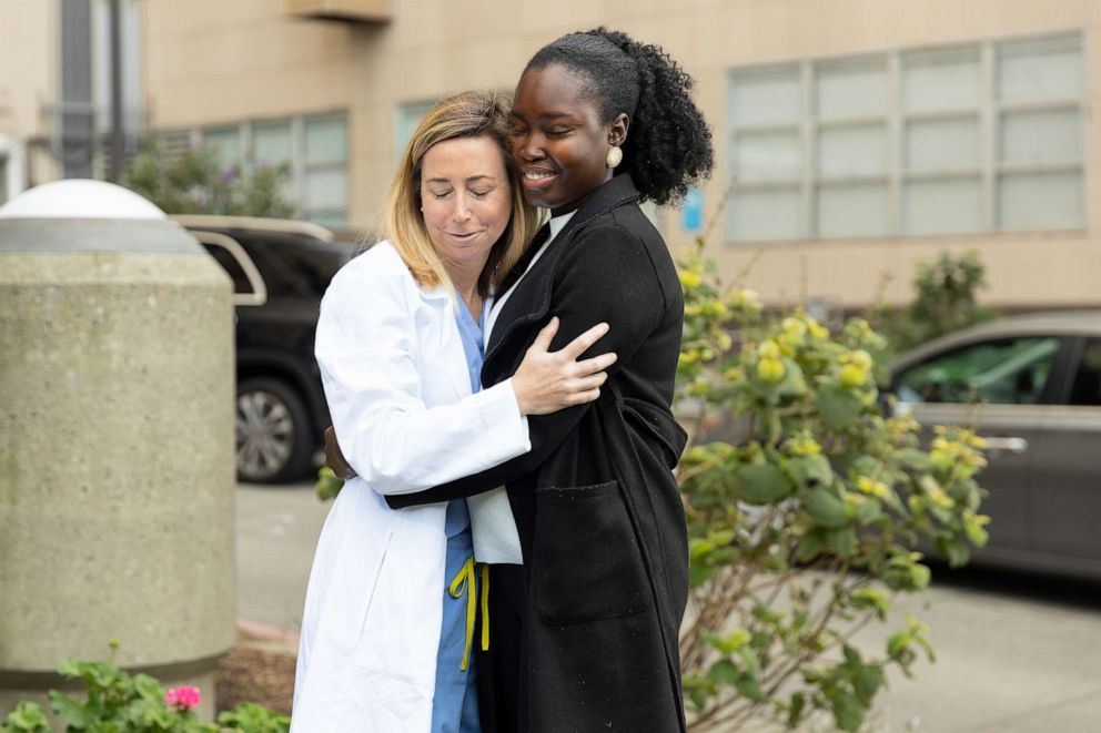 PHOTO: Dr. Amy Fiedler and Fatou Gaye share a hug outside UCSF Helen Diller Medical Center in San Francisco.