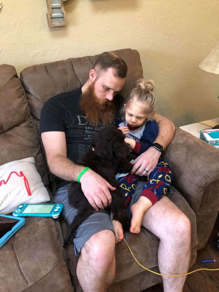 PHOTO: Dad Brett Palmer of Missouri, is seen with his 2-year-old son Truett and their goldendoodle. Truett was gifted the goldendoodle from a stranger on Facebook after receiving a heart transplant.