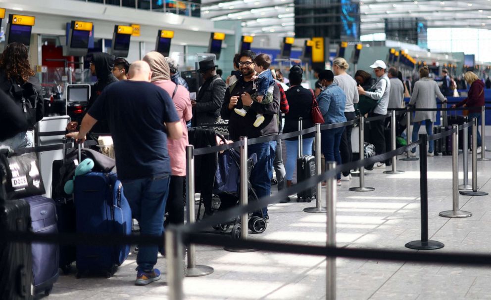PHOTO: Passengers queue for the check in desk at Heathrow Terminal 5 airport in London, Britain, June 1, 202