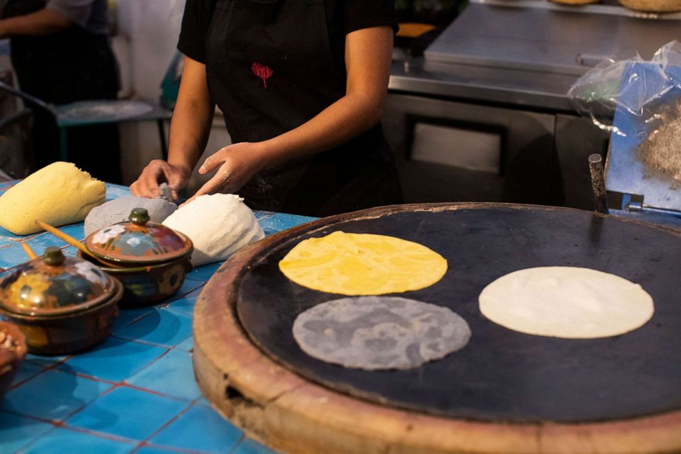 PHOTO: Corn tortillas a prepared in three colors in Oaxaca, Mexico, Aug. 14, 2021.