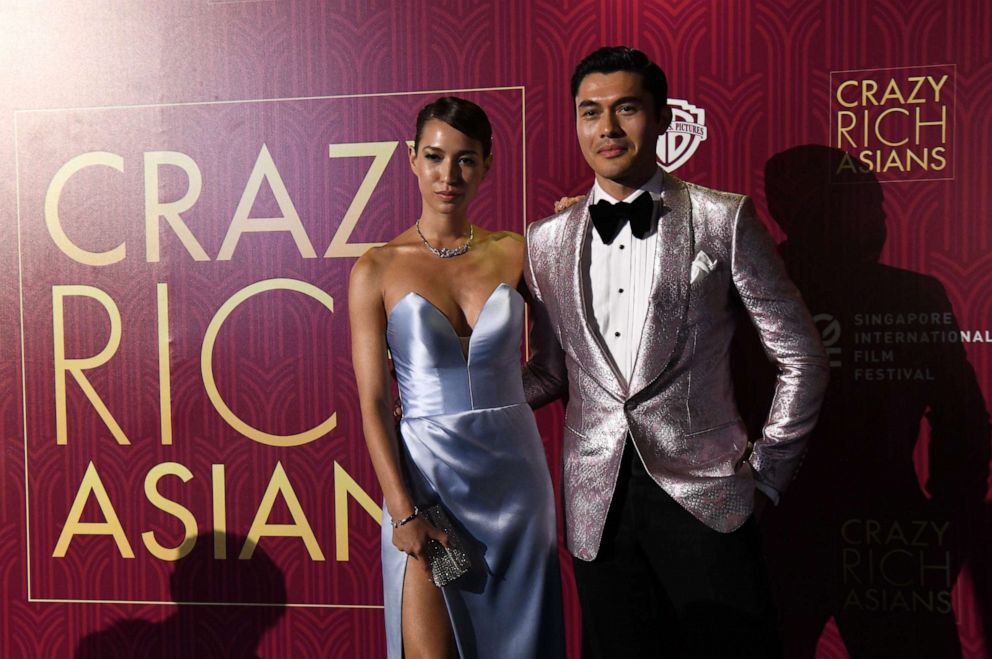 PHOTO: Actor Henry Golding and his wife Liv Lo Golding arrive at the film premiere of "Crazy Rich Asians" at the Capitol Theatre in Singapore on Aug. 21, 2018.