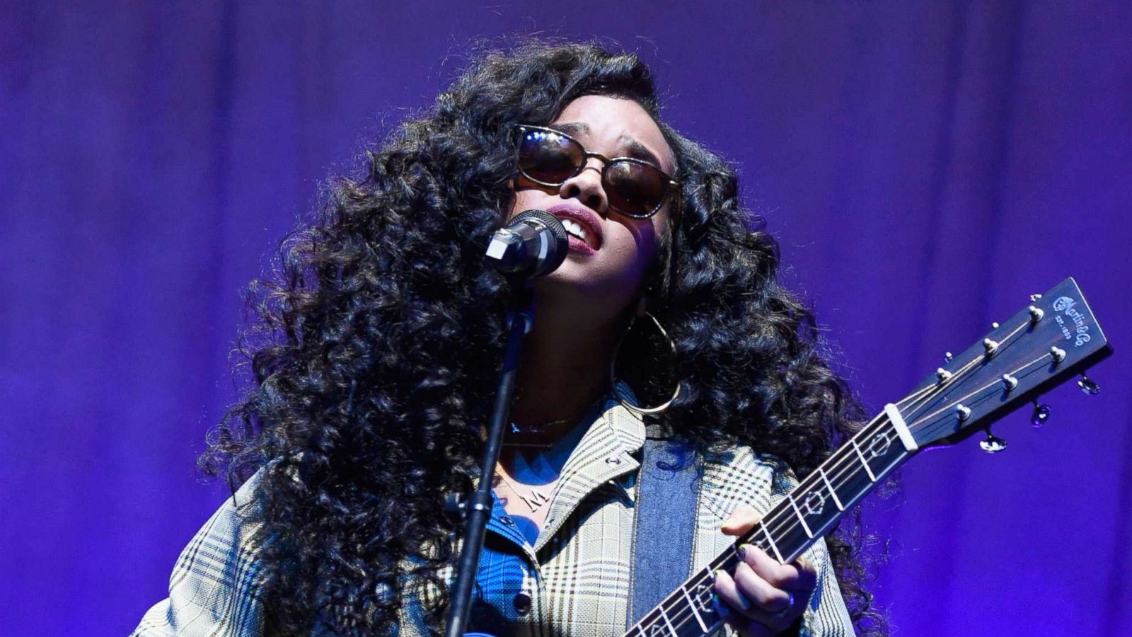 PHOTO: H.E.R. performs onstage during the Spotify "Best New Artist 2019" party, Feb. 7, 2019, in Los Angeles.