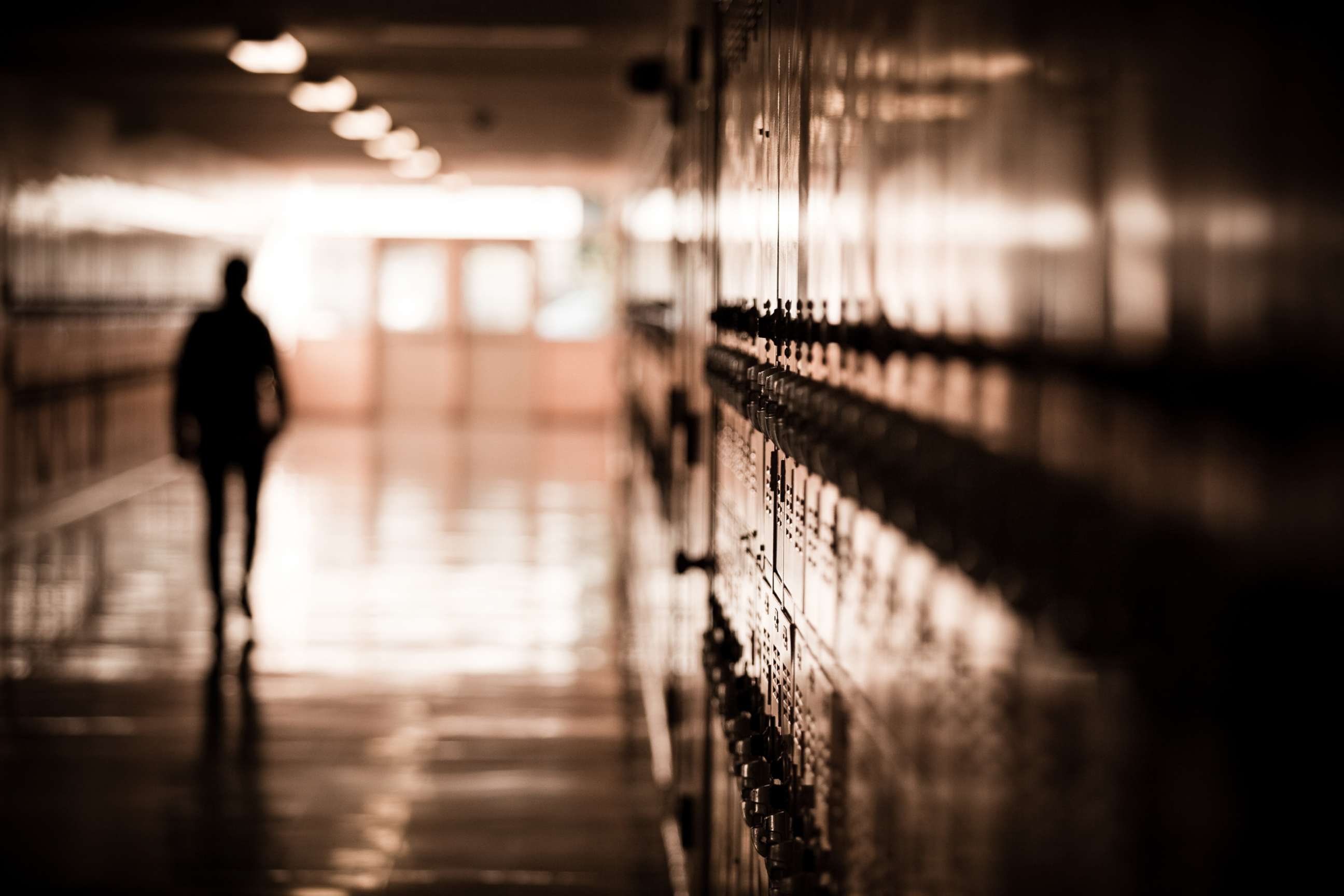 PHOTO: A high school student walks down a dark hallway in a public high school in this undated stock photo.