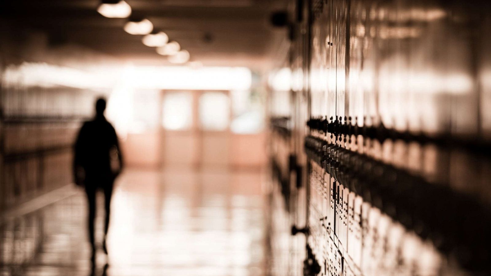 PHOTO: A high school student walks down a dark hallway in a public high school in this undated stock photo.