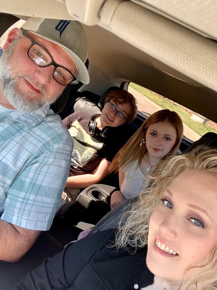 PHOTO: Max Hightower, back left, is seen with his family in a car.