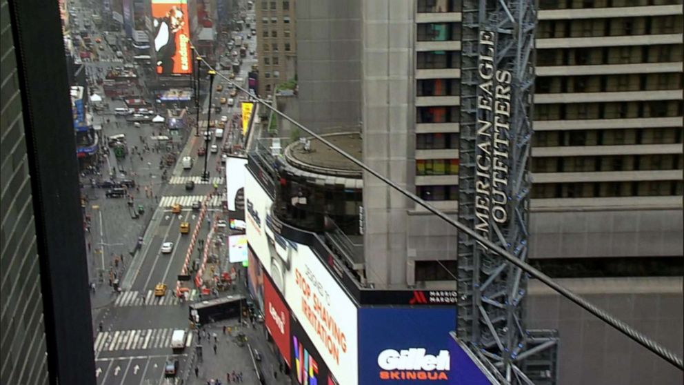 PHOTO: Acrobat siblings Nik and Lijana Wallenda prepare to attempt a highwire stunt in the middle of Times Square in New York City. 