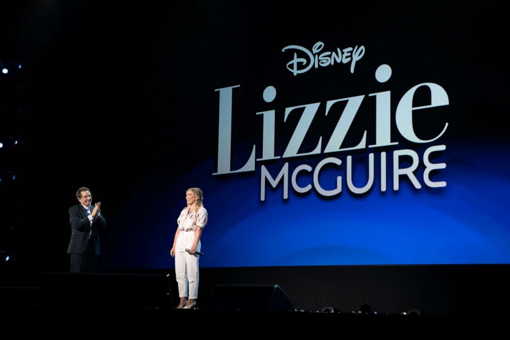 PHOTO: Gary Marsh from Disney Channels Worldwide and Hilary Duff appear on stage at the D23 Expo 2019 in the Anaheim Convention Center, Aug. 24, 2019.