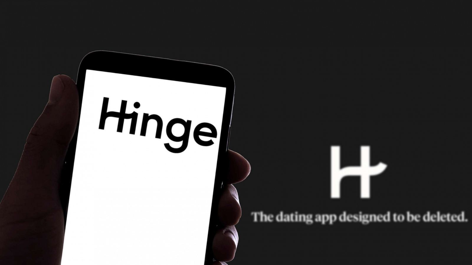 PHOTO: In this Nov. 16, 2021, file photo, the online dating app Hinge logo is seen on the screen of a mobile phone and the display of a laptop in Barcelona.