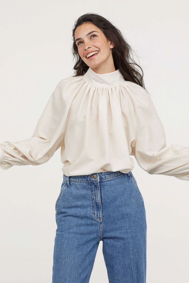 PHOTO:  Gotta love dramatic sleeves in clean white! This blouse does all your styling for you, whether you're wearing jeans or skirts. If you want to embellish the look, add a gold layered necklace or a belt, but that's it. Let the blouse steal the show.