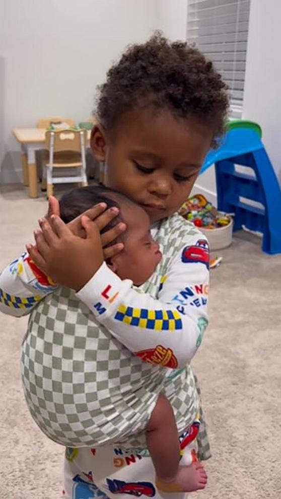 VIDEO: Big brother rocks baby sister in adorable video 