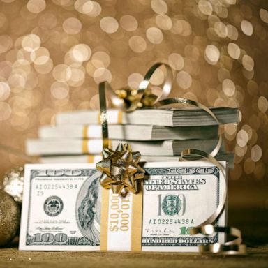 PHOTO: Stock photo of money and festive wrappings.