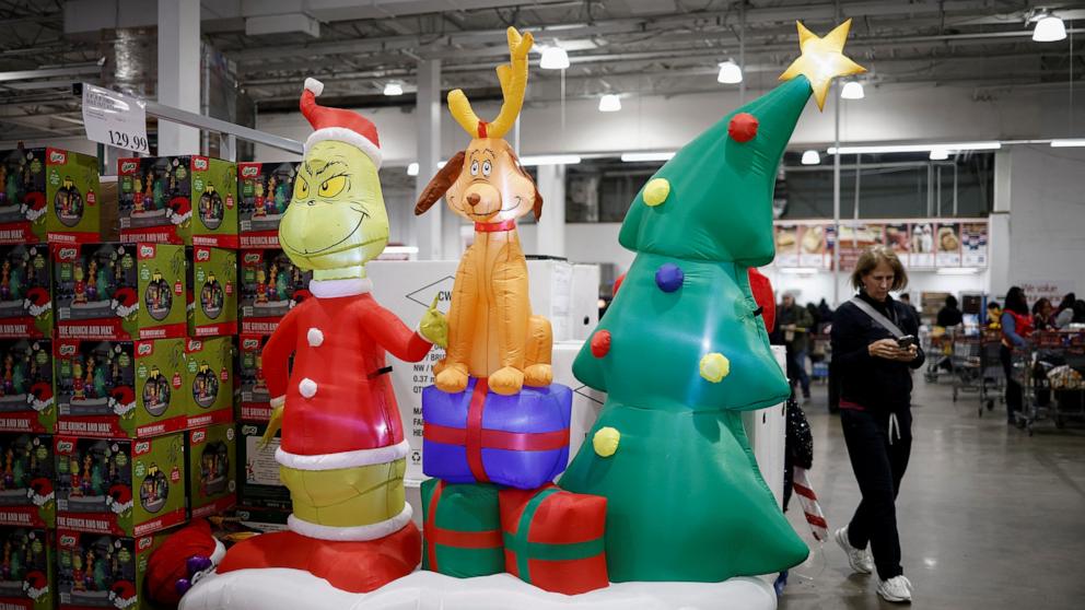 PHOTO: A shopper uses a mobile phone at a Costco store ahead of Black Friday in Arlington, Va., Nov. 27, 2024. 