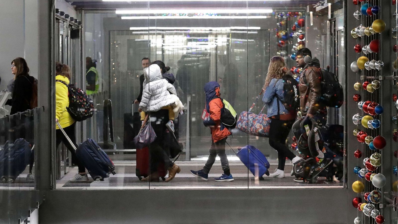 PHOTO: In this Nov. 27, 2019, file photo, travelers walk into Terminal 3 at O'Hare airport in Chicago.