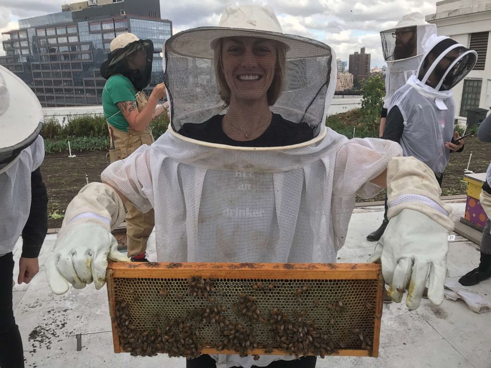 PHOTO: Holly Seidewand, Aberfeldy’s North American brand ambassador, holds up a small hive of bees.