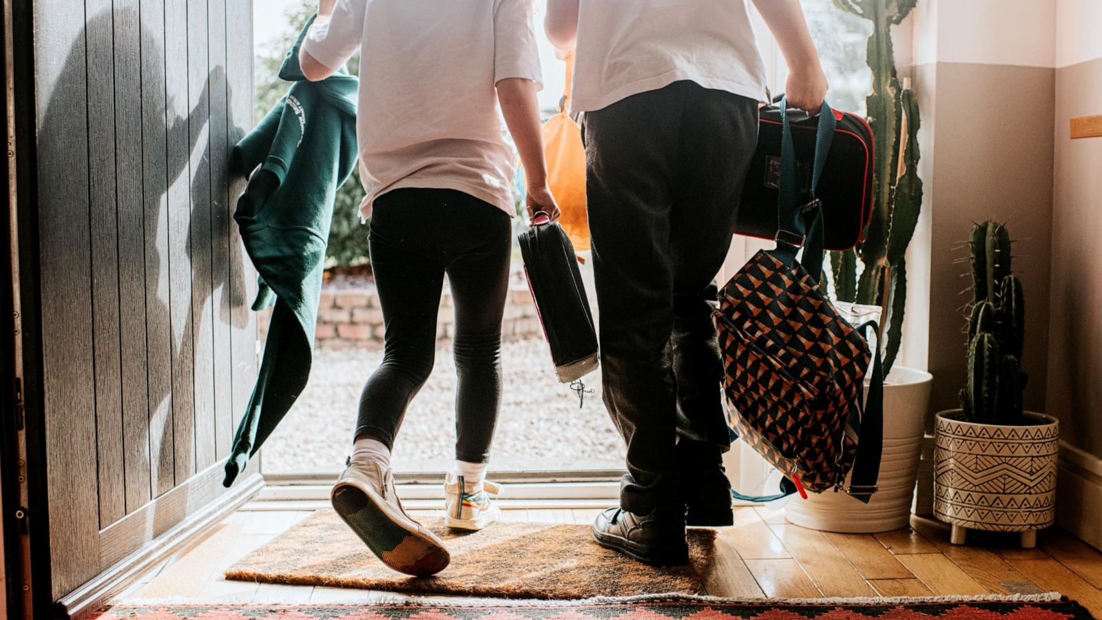 PHOTO: Stock photo of two kids leaving a home.