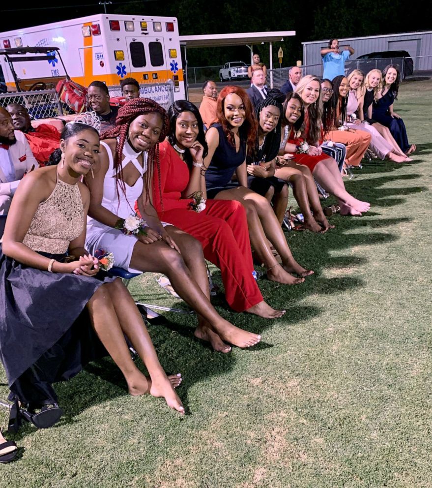 PHOTO: Twelve homecoming court candidates who walked barefoot across a football field in South Carolina in solidarity with their classmate.