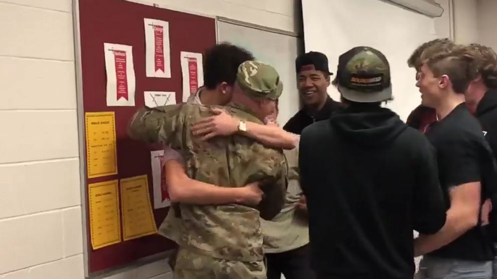 PHOTO: Captain Andrew Olson is greeted by his student athletes when he surprised them at school. 