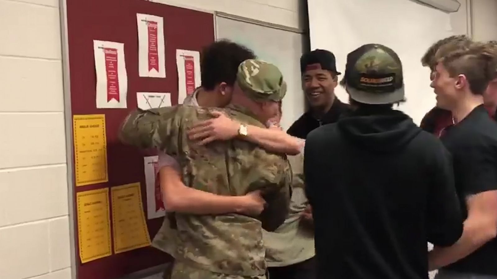 PHOTO: Captain Andrew Olson is greeted by his student athletes when he surprised them at school.