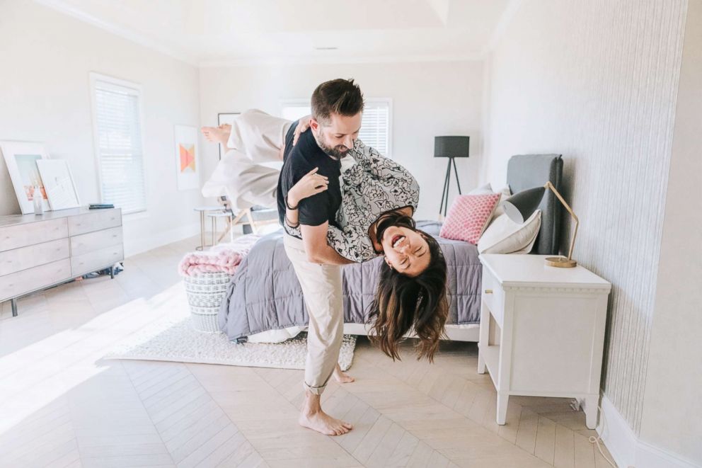 PHOTO: Johnny Earle and Katie Freketic pose in their newly-designed bedroom.