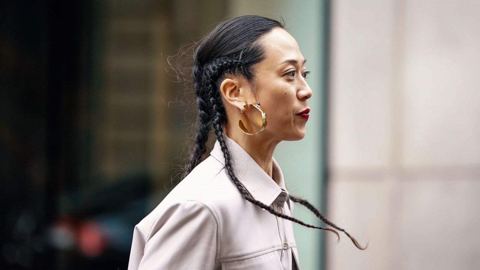 PHOTO: A guest wears earrings, a grey shirt, outside Thom Browne, during Paris Fashion Week Womenswear Fall/Winter 2019/2020, March 3, 2019 in Paris.