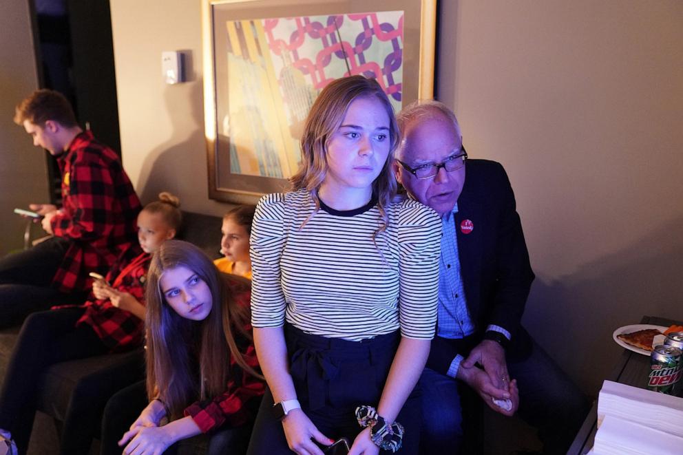 PHOTO: In this Nov. 6, 2018, file photo, gubernatorial candidate Tim Walz watches election results come in with his daughter, Hope, and extended family in their hotel suite at the Intercontinental Hotel in downtown St. Paul, Minn.