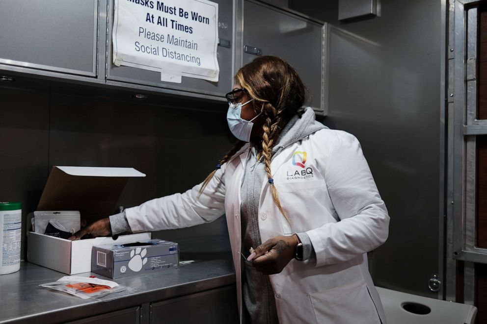 PHOTO: Jackie, a nurse, prepares a COVID-19 test at a mobile clinic in Brooklyn, Jan. 27, 2021, in New York.